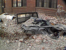 car crushed by bricks